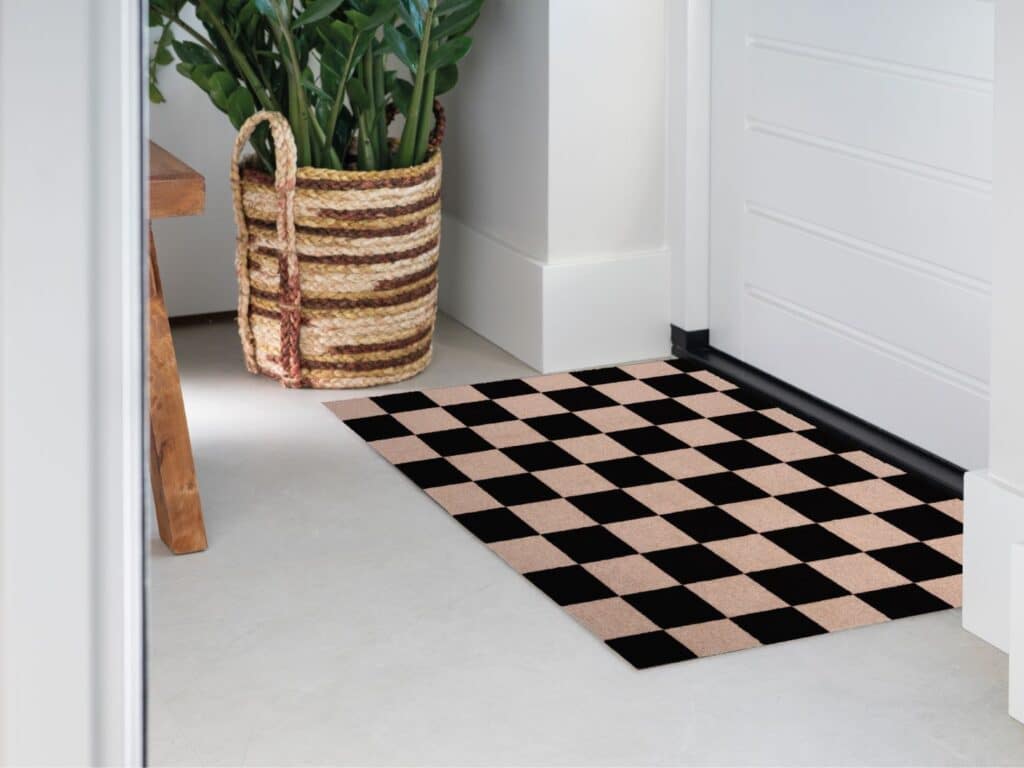 hoto of Mattigo Pixel Perfect black doormat at a front door