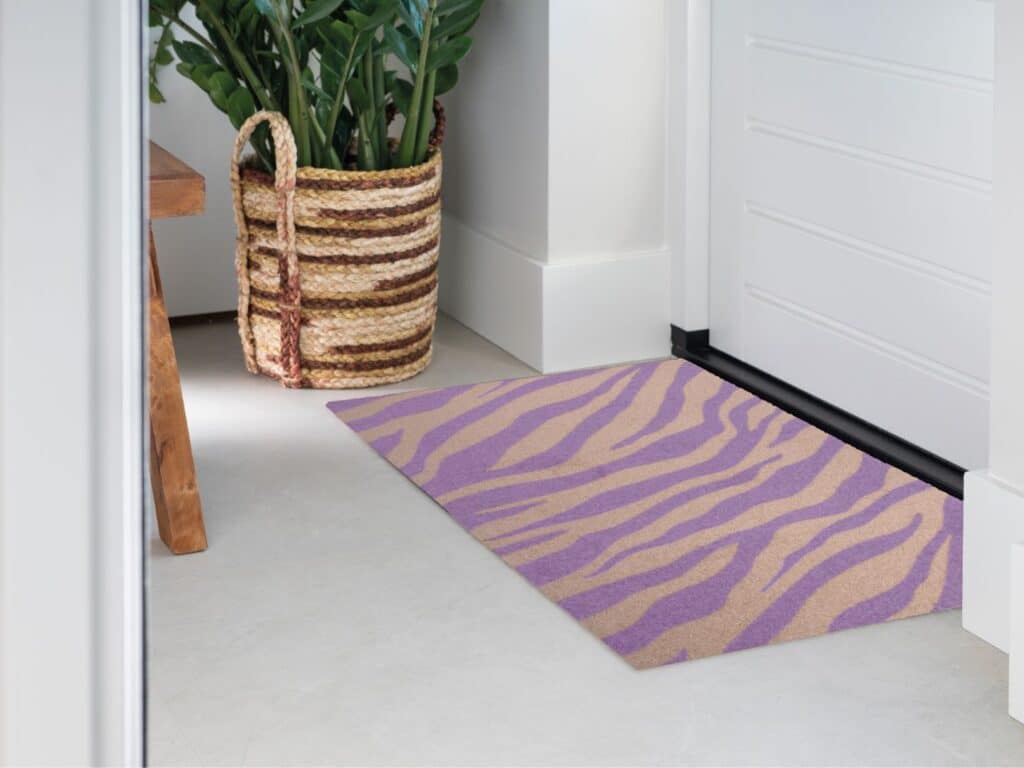 Photo of Mattigo Design mat Wildline lilac doormat at a front door